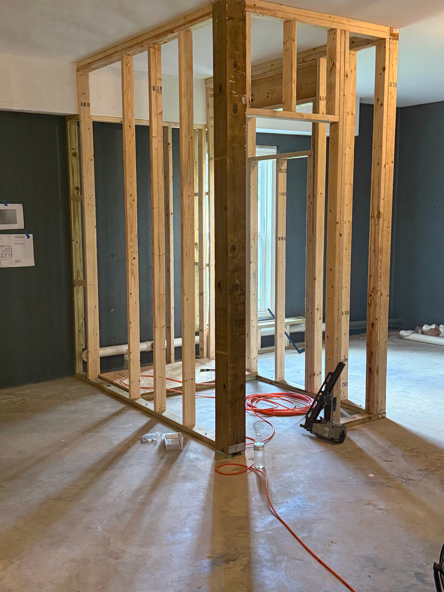 Bathroom partition framing - corner view with tools - Cleveland, TN