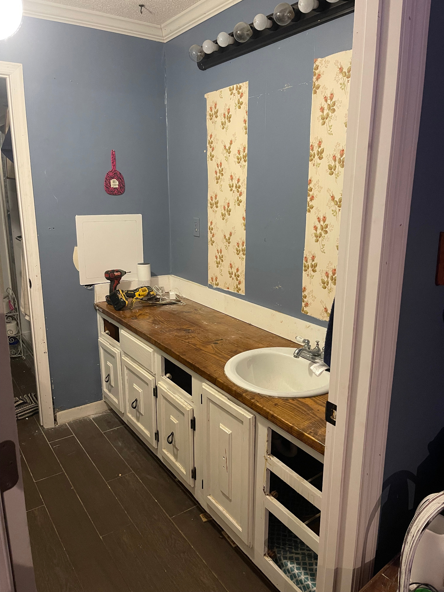Before - vanity and wallpaper, wide view - Cleveland, TN