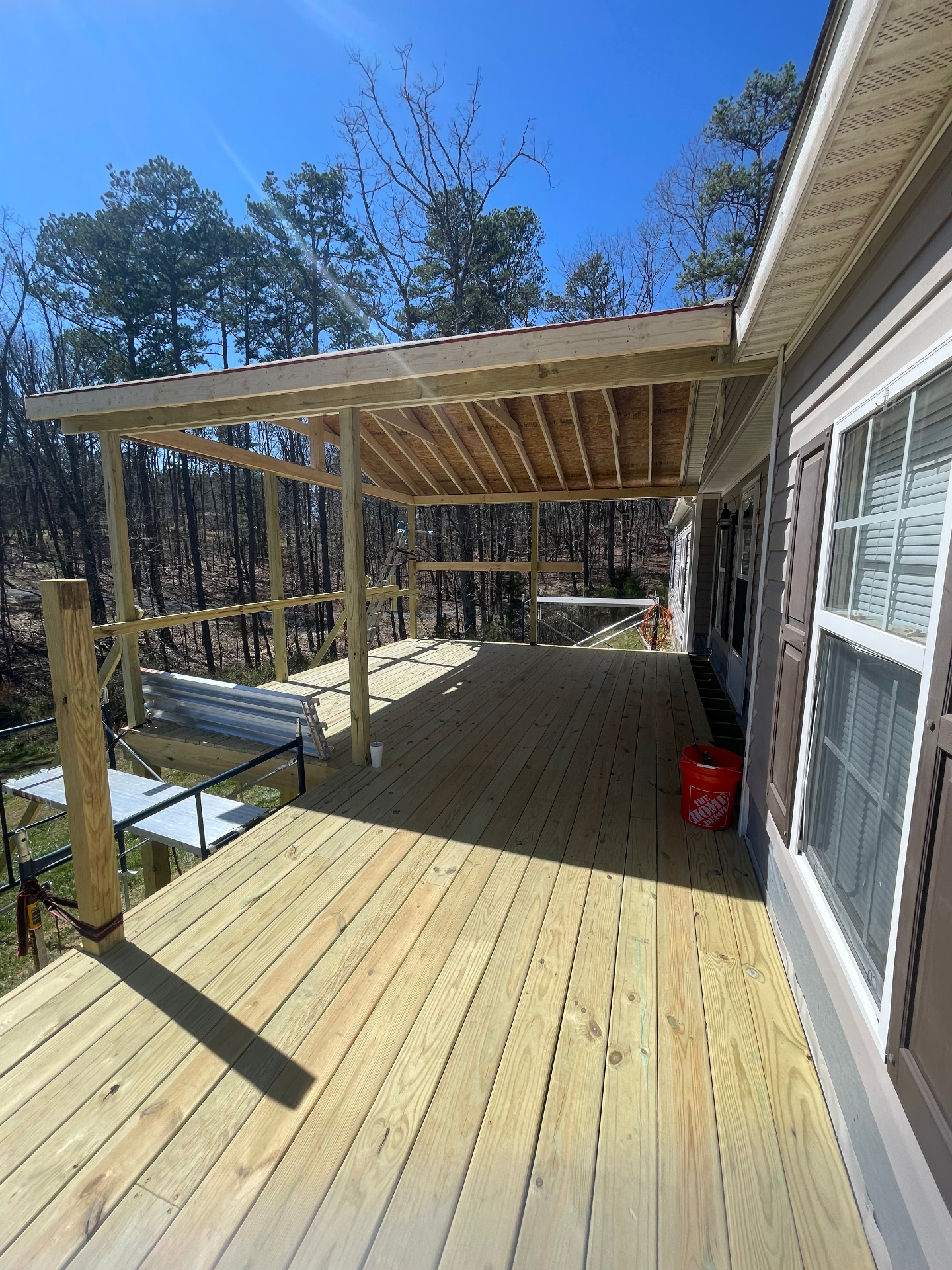Deck boards installed - covered porch interior - Cleveland, TN
