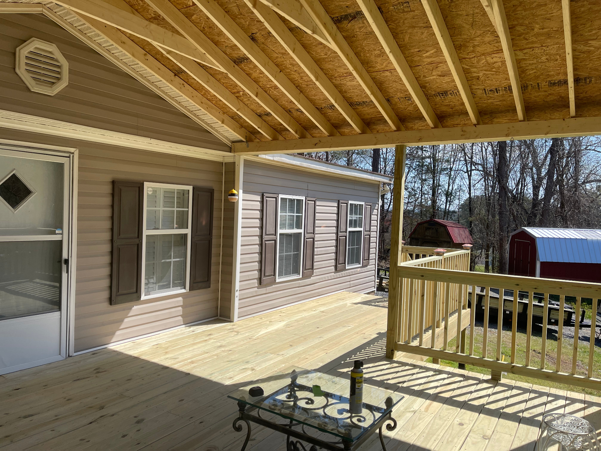 Covered porch interior - rafters and house wall detail - Cleveland, TN