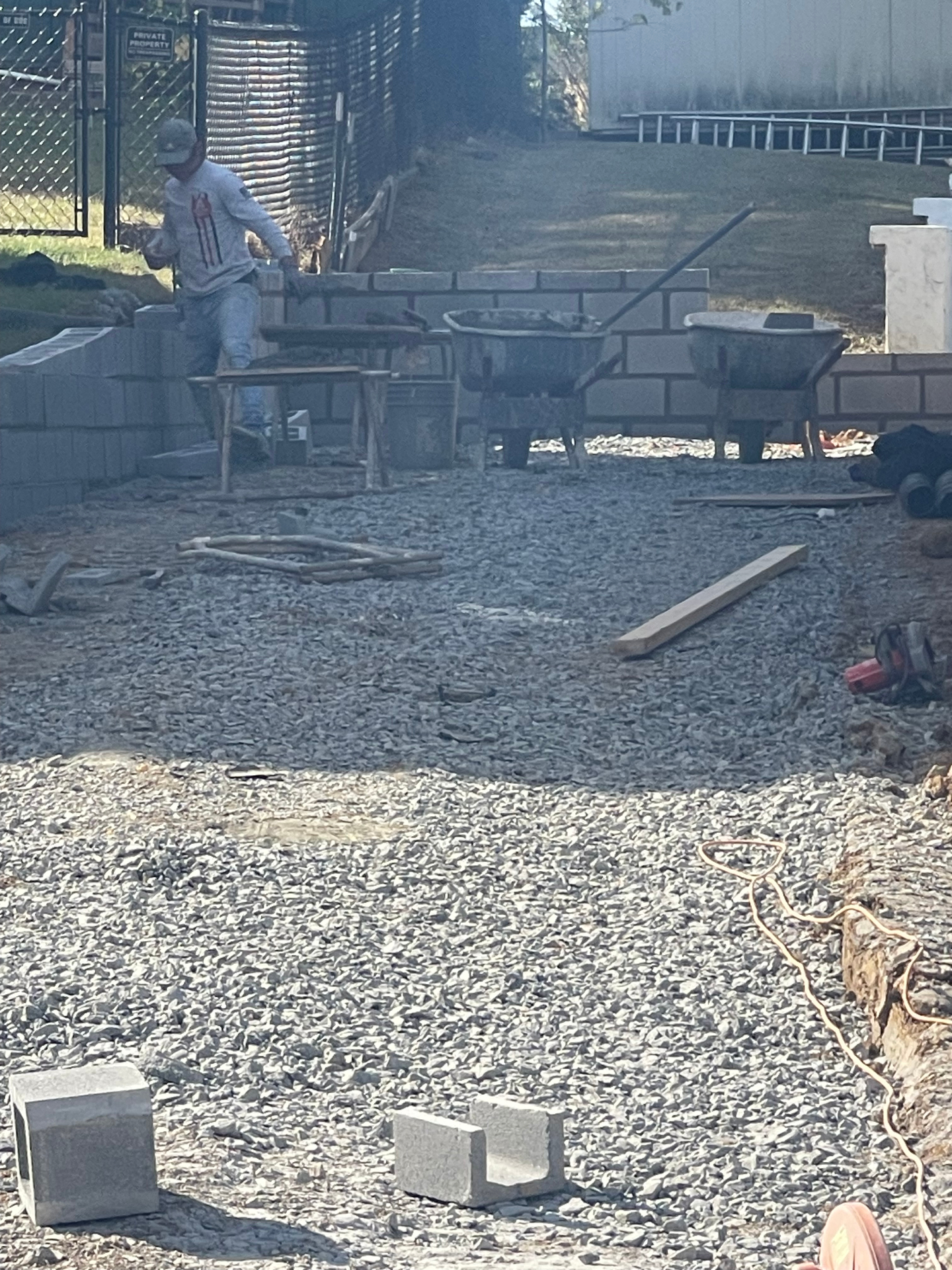 Mason laying block retaining wall - Cleveland, TN