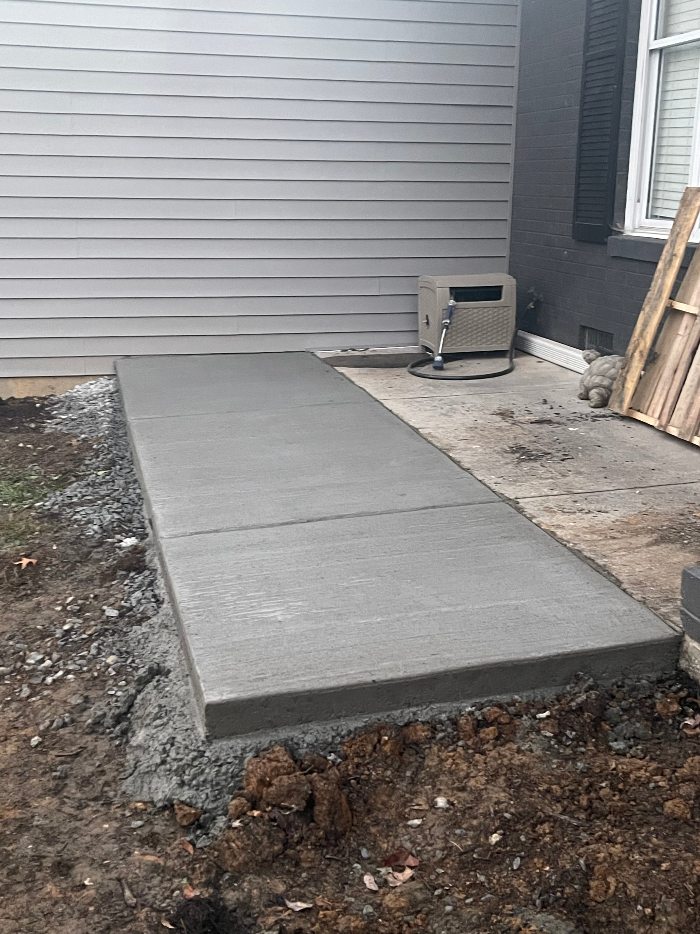 Side patio — fresh concrete poured - Cleveland, TN