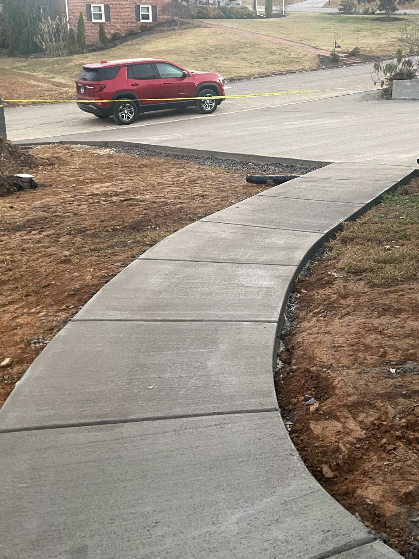 Freshly poured curved sidewalk to street - Cleveland, TN