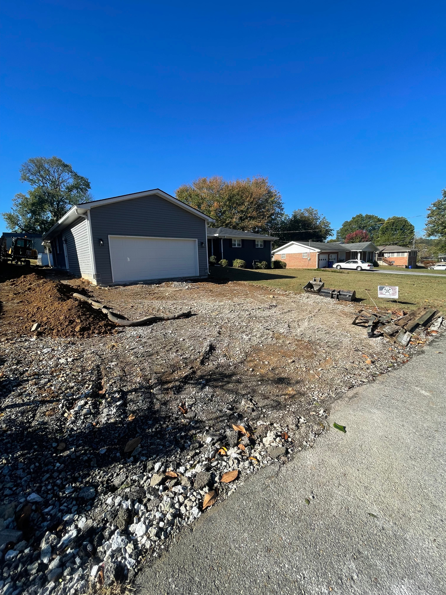 Yard grading and drainage pipe before driveway pour - Cleveland, TN