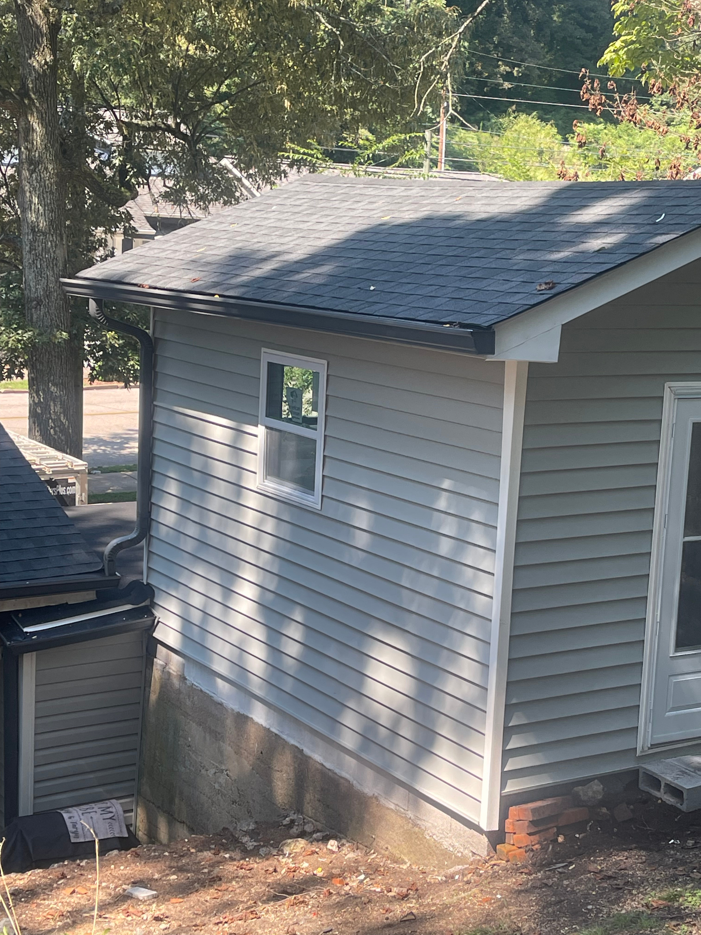 Vinyl siding and gutters installed - side view - Cleveland, TN