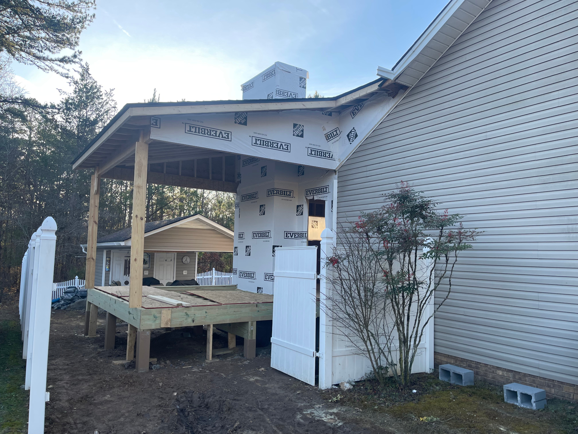 Covered deck with housewrap - roof and posts in place - Cleveland, TN