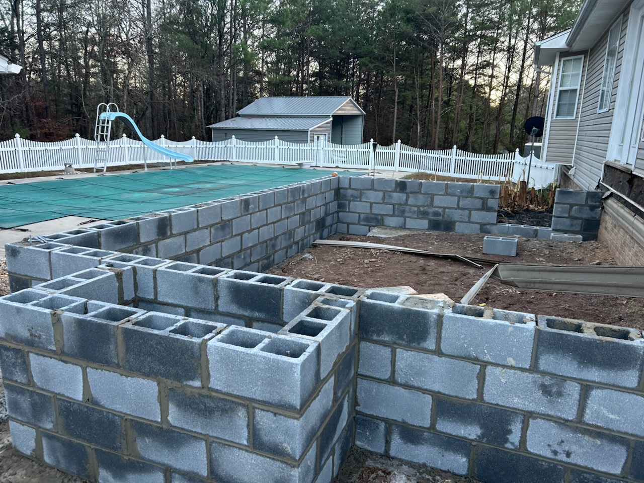 Block foundation walls with pool and yard view - Cleveland, TN