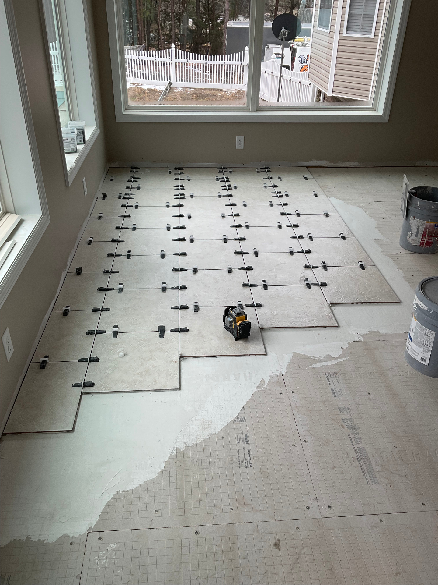 Interior tile flooring installation with leveling spacers - Cleveland, TN